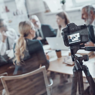 Modern,Business,Team,Discussing,Strategy,While,Filming,Staff,Meeting,In
